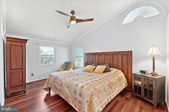 bedroom featuring a ceiling fan, lofted ceiling, crown molding, and dark wood-style floors