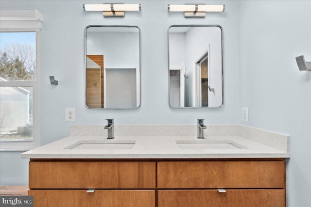 full bath with a sink and double vanity