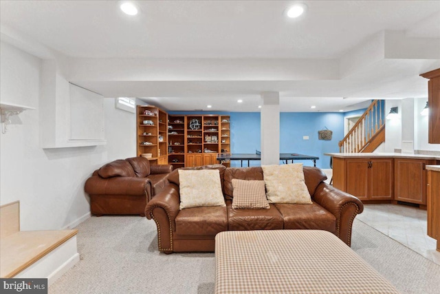 living room featuring stairway, recessed lighting, and baseboards