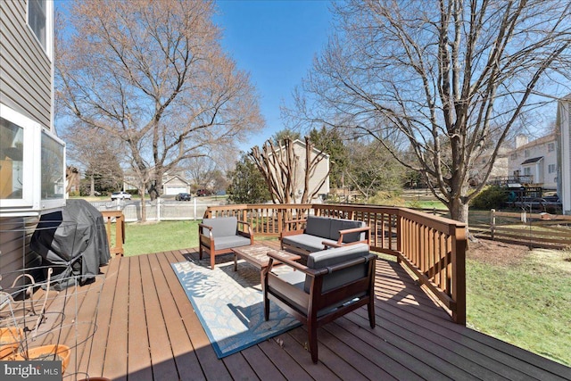 wooden terrace with an outdoor living space, a yard, and fence