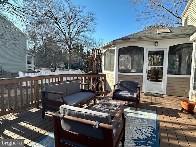 deck with an outdoor hangout area and a sunroom