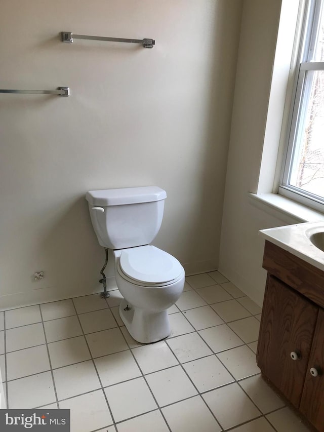 bathroom featuring vanity, toilet, and tile patterned floors