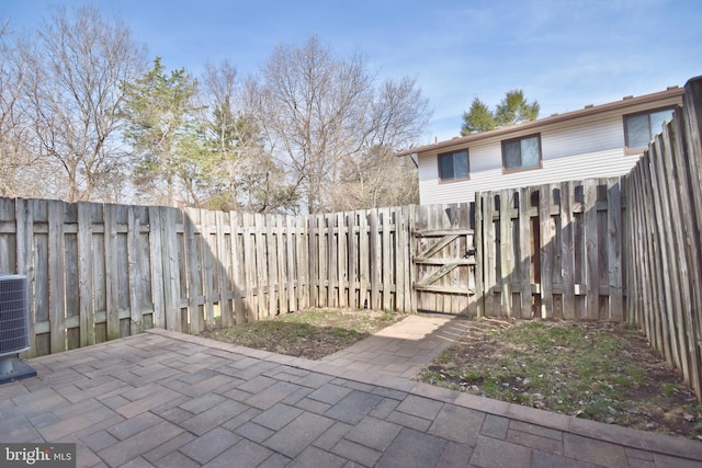 view of patio / terrace with a fenced backyard and a gate