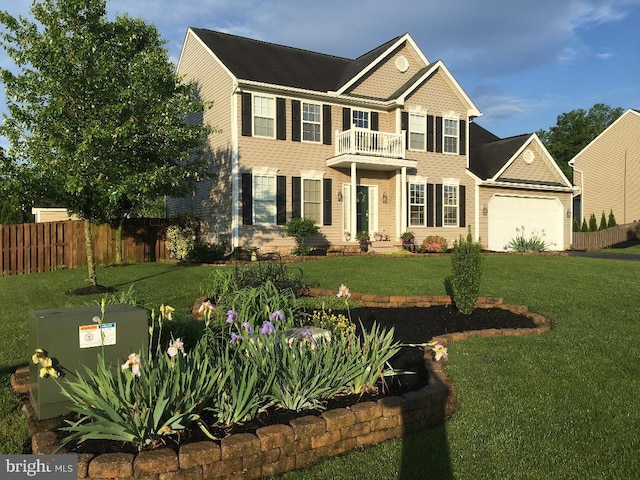 colonial home with a garage, a balcony, and a front lawn