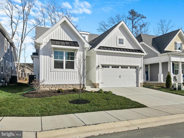 modern inspired farmhouse featuring board and batten siding, a standing seam roof, an attached garage, and concrete driveway