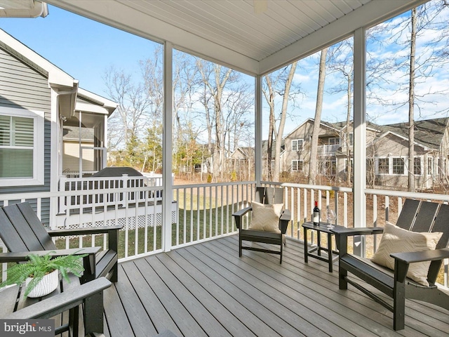 sunroom / solarium with a residential view