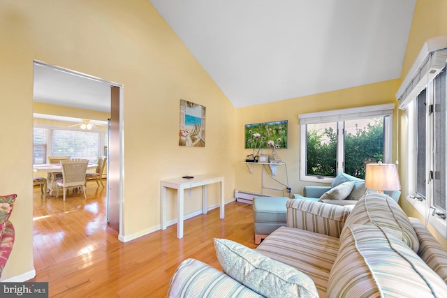 living room featuring a baseboard radiator, high vaulted ceiling, and light hardwood / wood-style flooring