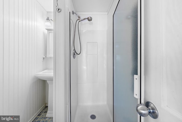 bathroom with tiled shower