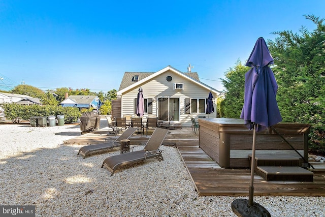 back of house with a wooden deck