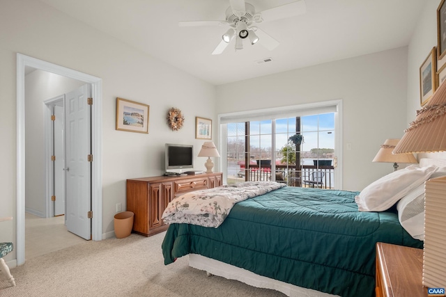 bedroom with ceiling fan, access to exterior, and light colored carpet