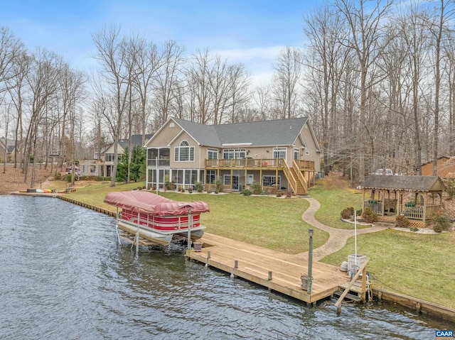 view of dock featuring a yard and a deck with water view