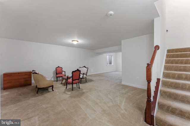 sitting room with light colored carpet