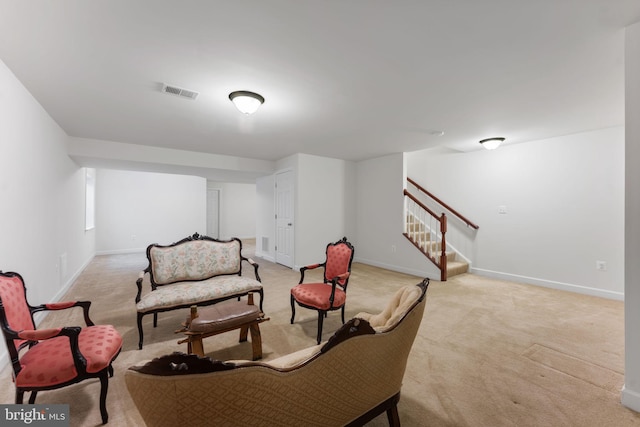 living area with light colored carpet