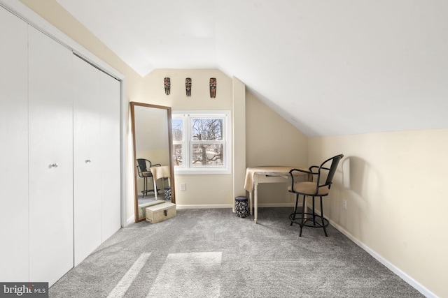 additional living space featuring carpet floors, baseboards, and vaulted ceiling