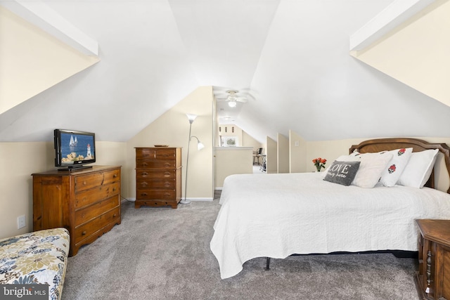 carpeted bedroom featuring vaulted ceiling