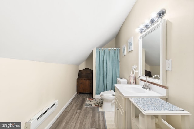 bathroom featuring lofted ceiling, toilet, wood finished floors, vanity, and baseboard heating