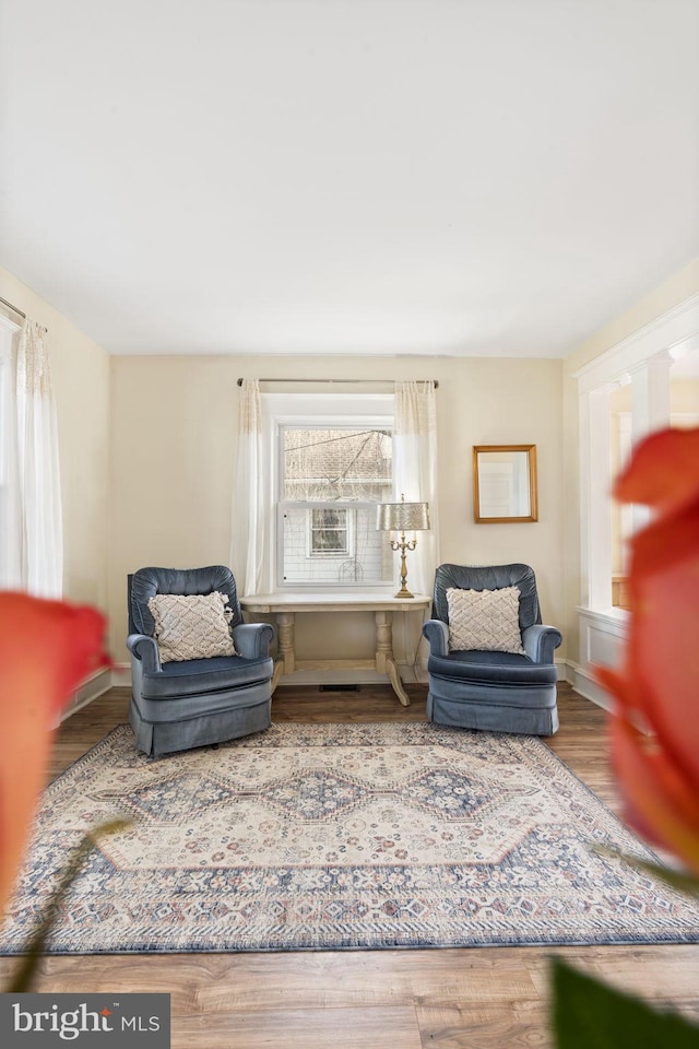 sitting room featuring wood finished floors