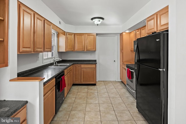 kitchen featuring sink, black appliances, and light tile patterned flooring