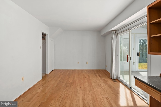 spare room featuring light wood-type flooring