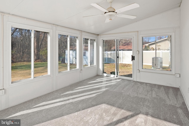 unfurnished sunroom with ceiling fan, lofted ceiling, and a wealth of natural light