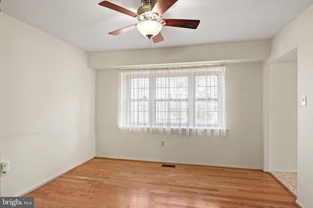 unfurnished room with ceiling fan and light hardwood / wood-style floors