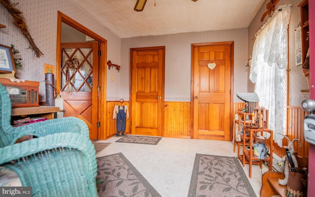 interior space featuring ceiling fan