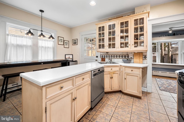 kitchen with a sink, a healthy amount of sunlight, light countertops, and dishwasher