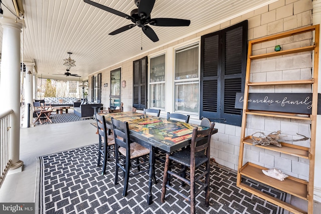 view of patio / terrace featuring a porch, outdoor dining area, and a ceiling fan