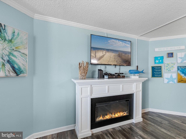 room details featuring a textured ceiling, baseboards, wood finished floors, and a glass covered fireplace