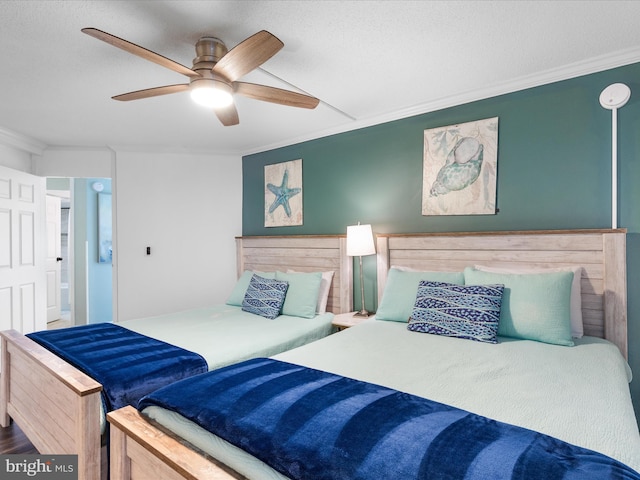 bedroom featuring ceiling fan and ornamental molding