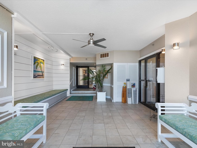 view of patio featuring visible vents and ceiling fan