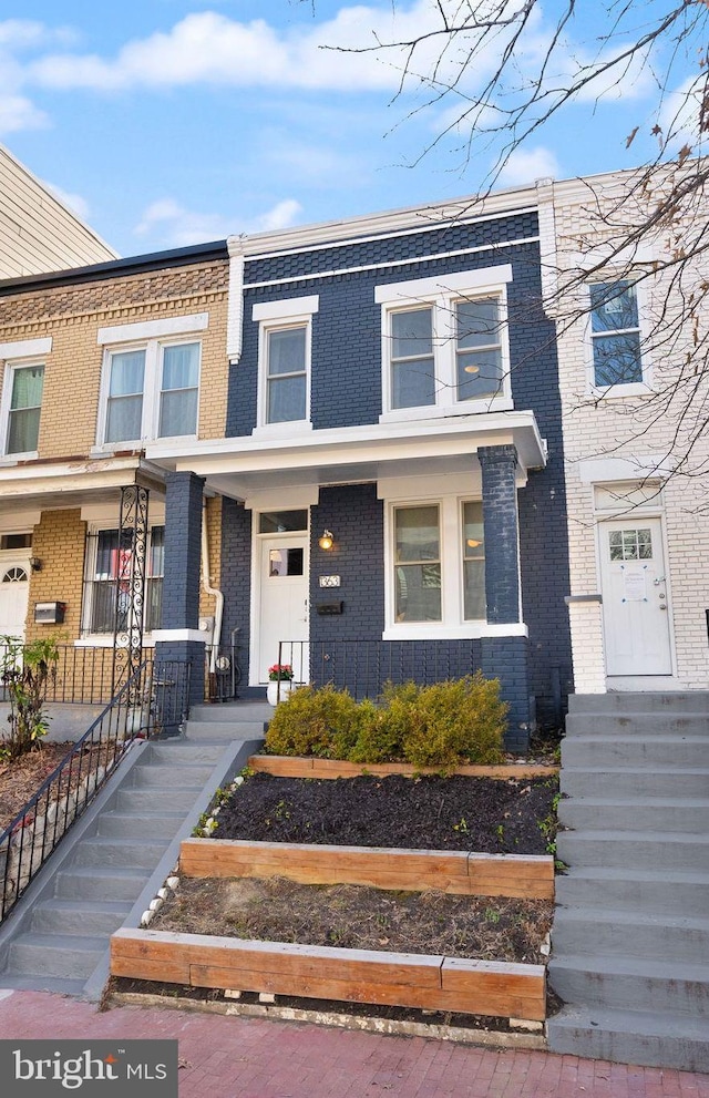 view of front of house featuring brick siding