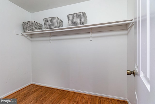 spacious closet with wood finished floors