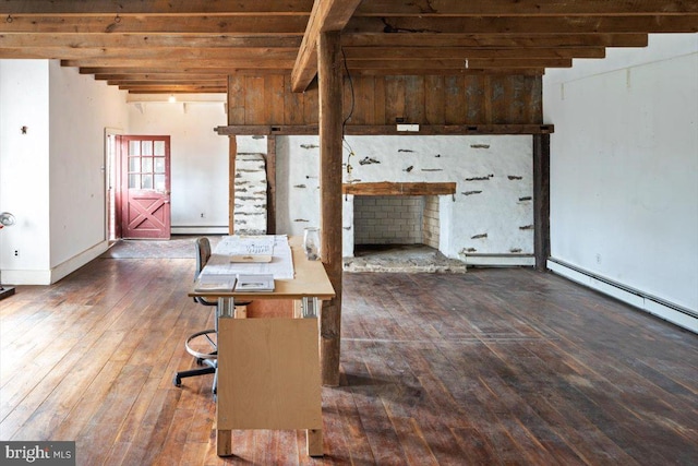 interior space featuring hardwood / wood-style flooring, baseboards, a baseboard heating unit, and beamed ceiling