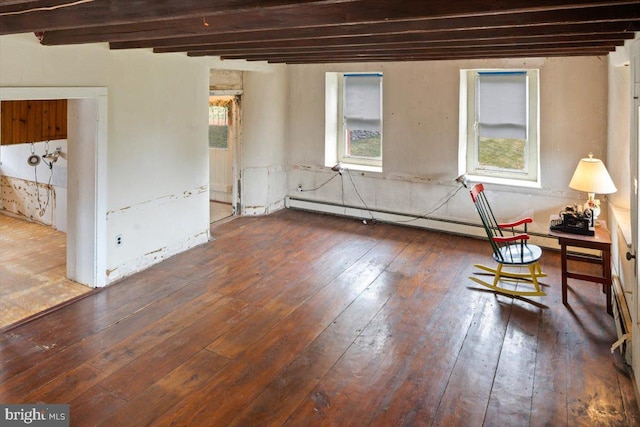 interior space with a baseboard radiator, beam ceiling, and hardwood / wood-style floors