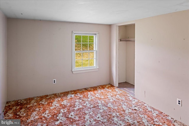 unfurnished bedroom featuring a closet