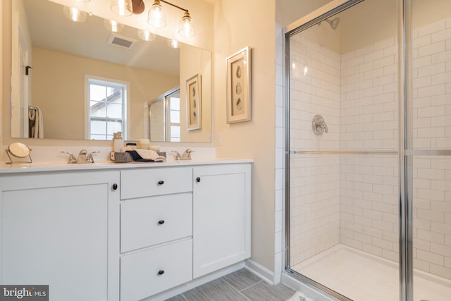 bathroom featuring vanity and walk in shower