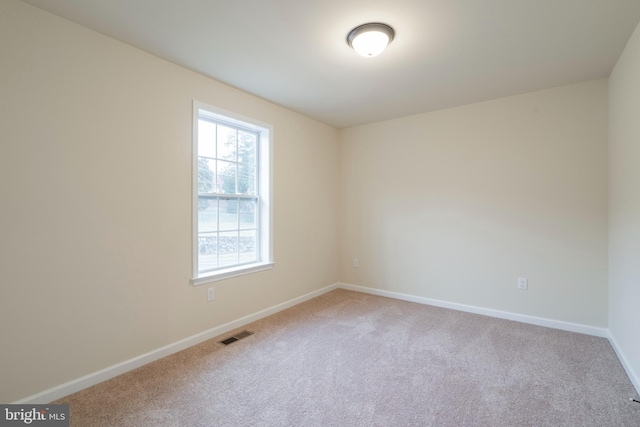 spare room with carpet flooring