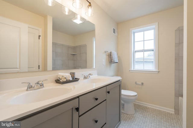 bathroom with toilet and vanity