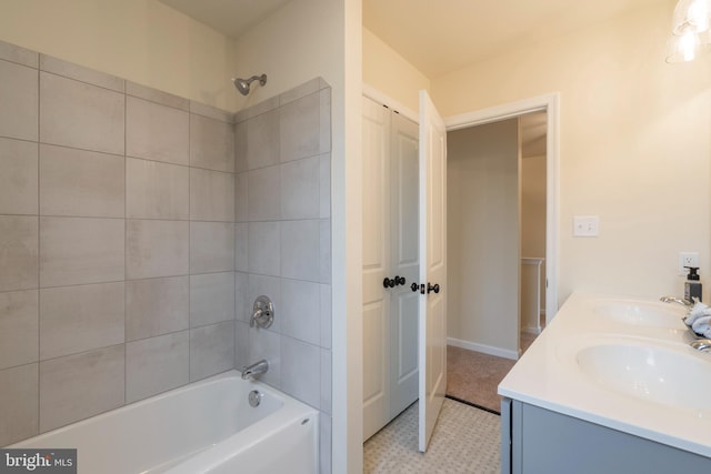 bathroom with vanity and tiled shower / bath combo