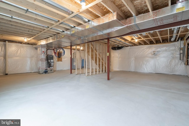 basement with heating unit and water heater