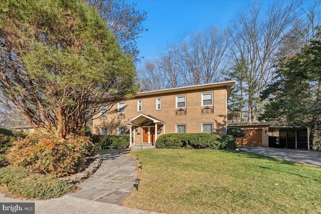 view of front of property with driveway and a front yard