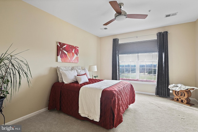 bedroom with baseboards, visible vents, ceiling fan, and carpet flooring