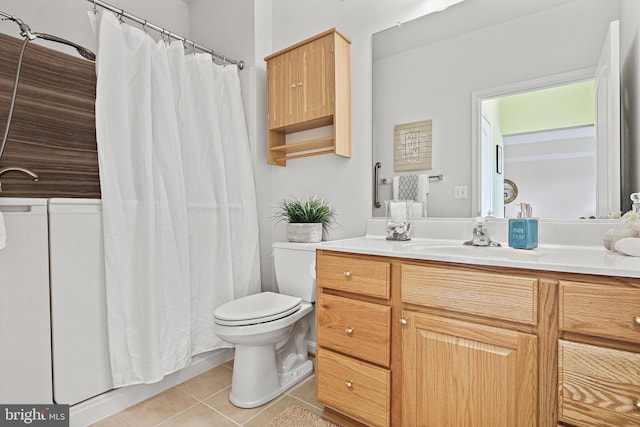 full bathroom with toilet, vanity, and tile patterned floors