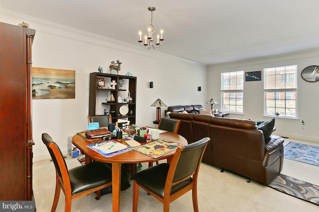 dining area featuring light carpet, baseboards, ornamental molding, and a chandelier