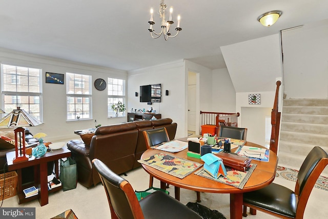 carpeted dining area with an inviting chandelier, plenty of natural light, stairway, and ornamental molding