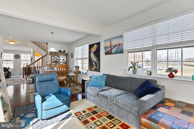 living room featuring stairs