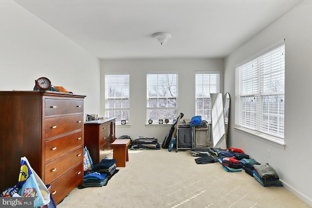 exercise area with carpet floors and baseboards