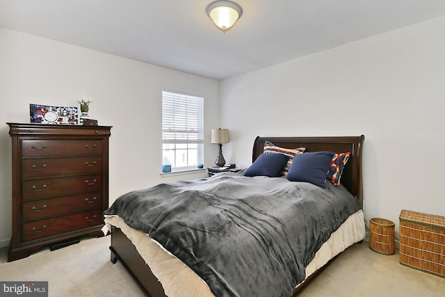 bedroom featuring light colored carpet