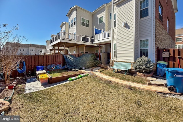 view of yard with a patio, fence, and a residential view